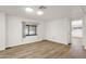 Cozy bedroom with wood floors and a bright window at 2650 W Union Hills Dr # 215, Phoenix, AZ 85027