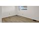 Comfortable bedroom featuring wood floors and a bright window at 2650 W Union Hills Dr # 215, Phoenix, AZ 85027