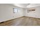Light-filled bedroom with two windows and wood-look flooring at 2650 W Union Hills Dr # 215, Phoenix, AZ 85027