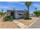 Charming single-story home with desert landscaping, including mature cactus and palm trees at 2650 W Union Hills Dr # 215, Phoenix, AZ 85027