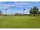 Enjoy the community's expansive green space, a scenic landscape with mature trees at 2650 W Union Hills Dr # 215, Phoenix, AZ 85027