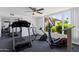 Fitness center with treadmill, elliptical machine, weight rack, and mirrored wall at 2650 W Union Hills Dr # 215, Phoenix, AZ 85027
