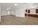 Open living room featuring modern flooring and access to the kitchen at 2650 W Union Hills Dr # 215, Phoenix, AZ 85027