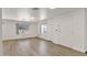 Inviting living room with wood floors, windows, and a welcoming entrance at 2650 W Union Hills Dr # 215, Phoenix, AZ 85027