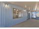 Enclosed porch with a wall of windows and access to the front door at 2650 W Union Hills Dr # 215, Phoenix, AZ 85027