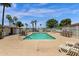 Outdoor swimming pool with sun loungers and lush landscaping around it at 2650 W Union Hills Dr # 215, Phoenix, AZ 85027