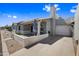 Single-story home with attached garage and front porch with desert-friendly landscaping and patio at 2929 E Broadway Rd # 50, Mesa, AZ 85204