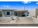Charming single-story home featuring a cozy front porch and well-maintained desert landscaping at 2929 E Broadway Rd # 50, Mesa, AZ 85204