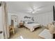 Bright main bedroom with ceiling fan, carpet flooring, and a built in closet system at 2929 E Broadway Rd # 50, Mesa, AZ 85204