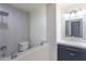 Contemporary bathroom featuring tiled shower with rainfall showerhead and a modern vanity at 3325 S Shafer Dr, Tempe, AZ 85282