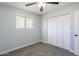 Comfortable bedroom with a window, closet, and ceiling fan at 3325 S Shafer Dr, Tempe, AZ 85282