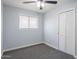 Neutral bedroom featuring plush carpet, a ceiling fan, a window with blinds, and closet at 3325 S Shafer Dr, Tempe, AZ 85282