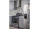 Updated kitchen showcasing stainless steel appliances, gray cabinets, and quartz countertops at 3325 S Shafer Dr, Tempe, AZ 85282