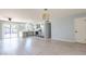 Stylish living space with light-colored floors, updated kitchen, and stainless steel appliances at 3325 S Shafer Dr, Tempe, AZ 85282