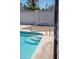 Swimming pool with tiled edge and coping surrounded by a patio and rock landscaping at 3325 S Shafer Dr, Tempe, AZ 85282