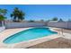 Backyard oasis featuring a sparkling pool, rock landscaping and perimeter fencing at 3325 S Shafer Dr, Tempe, AZ 85282
