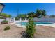 Inviting pool in a backyard with rock landscaping and privacy fencing at 3325 S Shafer Dr, Tempe, AZ 85282