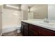 Bathroom features a shower-tub combo, tile flooring, and a vanity with counter space at 3338 E Coconino Dr, Gilbert, AZ 85298