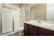 Bathroom with vanity, shower and wood-look floor at 3338 E Coconino Dr, Gilbert, AZ 85298