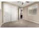 Bedroom with plush carpet, closet and natural light at 3338 E Coconino Dr, Gilbert, AZ 85298