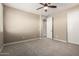 Bedroom showcasing neutral walls, carpet flooring, and a closet with sliding doors at 3338 E Coconino Dr, Gilbert, AZ 85298