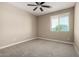 Bedroom featuring neutral walls, carpet flooring, and a ceiling fan for added comfort at 3338 E Coconino Dr, Gilbert, AZ 85298