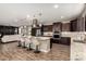 Spacious kitchen with granite countertops, stainless steel appliances, and adjacent living space at 3338 E Coconino Dr, Gilbert, AZ 85298