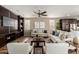 Comfortable living room features built-in shelving, ceiling fan and two sofas with throw pillows at 3338 E Coconino Dr, Gilbert, AZ 85298