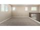 Loft area features neutral walls, carpet flooring, and natural light from multiple windows at 3338 E Coconino Dr, Gilbert, AZ 85298