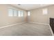 Loft area featuring neutral walls, carpet flooring, and natural light from multiple windows at 3338 E Coconino Dr, Gilbert, AZ 85298