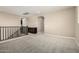Loft area features neutral walls, carpet, and a railing overlooking the lower level at 3338 E Coconino Dr, Gilbert, AZ 85298