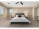 Spacious main bedroom with plush carpet, tray ceiling, and natural light at 3338 E Coconino Dr, Gilbert, AZ 85298