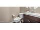 Modern powder room featuring vanity, toilet and tile floor at 3338 E Coconino Dr, Gilbert, AZ 85298