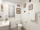 Bathroom featuring a vanity with a toilet, a towel rack, and decorative eagle pictures at 3515 E Kings Ave, Phoenix, AZ 85032