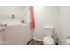 Bathroom featuring a walk-in bathtub with pink shower curtain and a toilet at 3515 E Kings Ave, Phoenix, AZ 85032