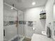 Modern bathroom with glass-enclosed shower, contemporary fixtures, and stylish tile accents at 3515 E Kings Ave, Phoenix, AZ 85032