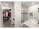 Bathroom with a closet, and shower including a granite countertop vanity with a glass enclosed shower at 3515 E Kings Ave, Phoenix, AZ 85032