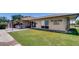 Charming Palm Lakes Village office and clubhouse with well-manicured lawn at 3515 E Kings Ave, Phoenix, AZ 85032