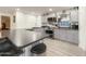 Modern kitchen boasts stainless steel appliances, gray cabinets, and a sleek breakfast bar at 3515 E Kings Ave, Phoenix, AZ 85032