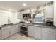 Updated kitchen featuring gray cabinets, stainless steel appliances, and ample counter space at 3515 E Kings Ave, Phoenix, AZ 85032