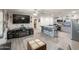 Open-concept living room and kitchen offers a breakfast bar and contemporary decor at 3515 E Kings Ave, Phoenix, AZ 85032