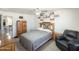 Comfortable bedroom featuring neutral tones, a ceiling fan, and ample closet space at 3515 E Kings Ave, Phoenix, AZ 85032