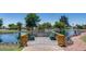Scenic view of the community pond with wooden pier and benches at 3515 E Kings Ave, Phoenix, AZ 85032