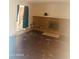 Open living room with a fireplace, hardwood floors, and neutral walls, ready for personalization at 4316 W Rose Ln, Glendale, AZ 85301