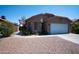Inviting single-Gathering home with a two-car garage, desert landscaping, and an American flag at 4527 E Amberwood Dr, Phoenix, AZ 85048