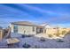 Low maintenance backyard with gravel, sparse plants, covered patio and privacy walls provides a serene outdoor space at 5267 E Diatomite Dr, San Tan Valley, AZ 85143