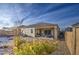 Spacious backyard with desert landscaping and a covered patio at 5267 E Diatomite Dr, San Tan Valley, AZ 85143