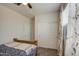 Comfortable bedroom with a bed, closet, and window, enhanced by a ceiling fan and natural light at 5267 E Diatomite Dr, San Tan Valley, AZ 85143