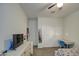 Bright bedroom with carpet, ceiling fan, closet and a desk with chair at 5267 E Diatomite Dr, San Tan Valley, AZ 85143