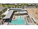 Aerial view of a community pool and recreation center with sun loungers and landscaped areas at 5267 E Diatomite Dr, San Tan Valley, AZ 85143